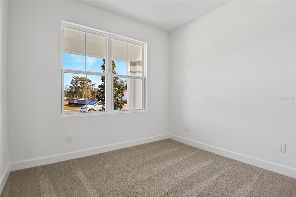 151 Waterstone Loop Tavares, FL 32778 - Photo 3 of 20 an empty room with a window