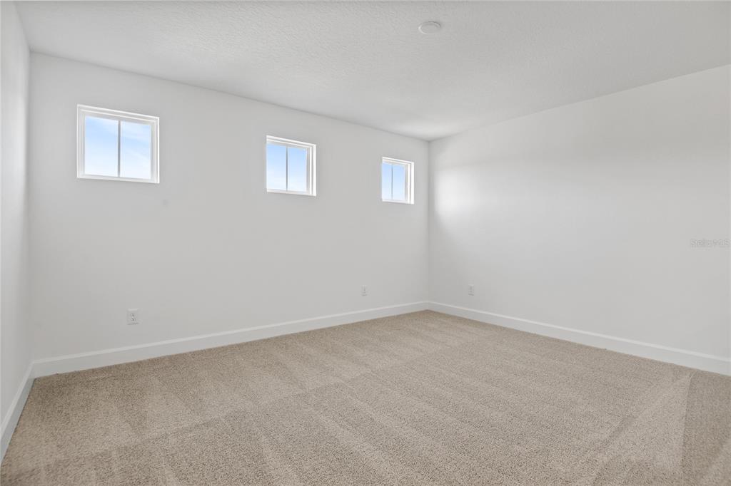 151 Waterstone Loop Tavares, FL 32778 - Photo 10 of 20 a view of an empty room with a window
