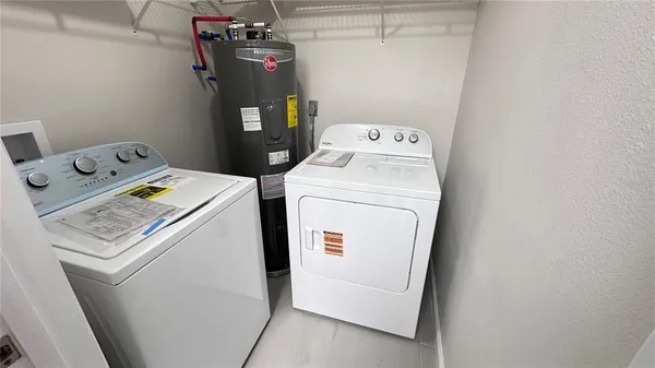 a utility room with dryer and washer