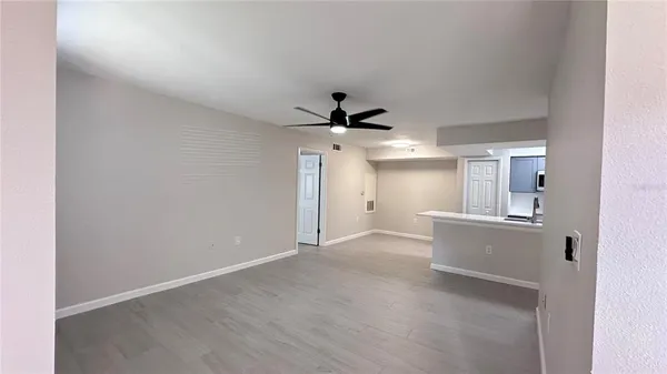 a view of a kitchen with a sink and cabinet