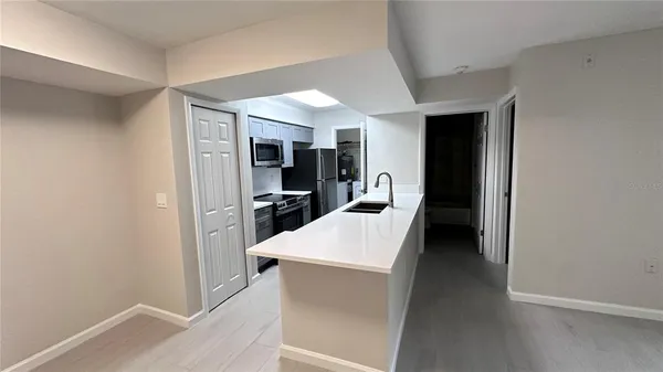 a view of a kitchen from the hallway