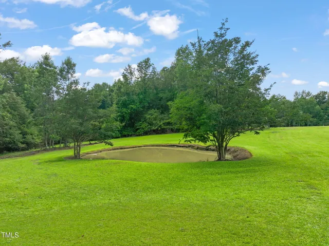 a view of swimming pool with a yard
