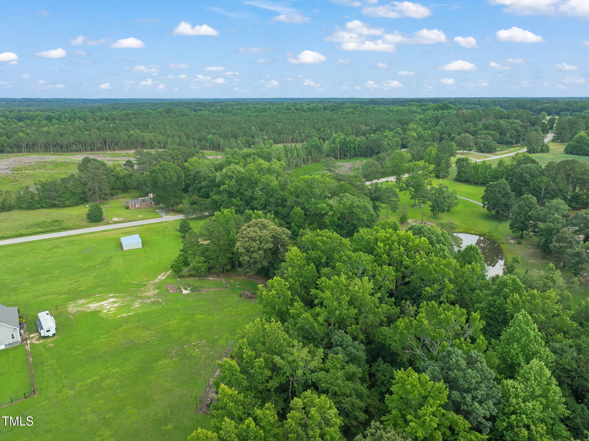 Lot 2 Raleigh Road Four Oaks, NC 27524 - Photo 7 of 12 a view of a lush green field