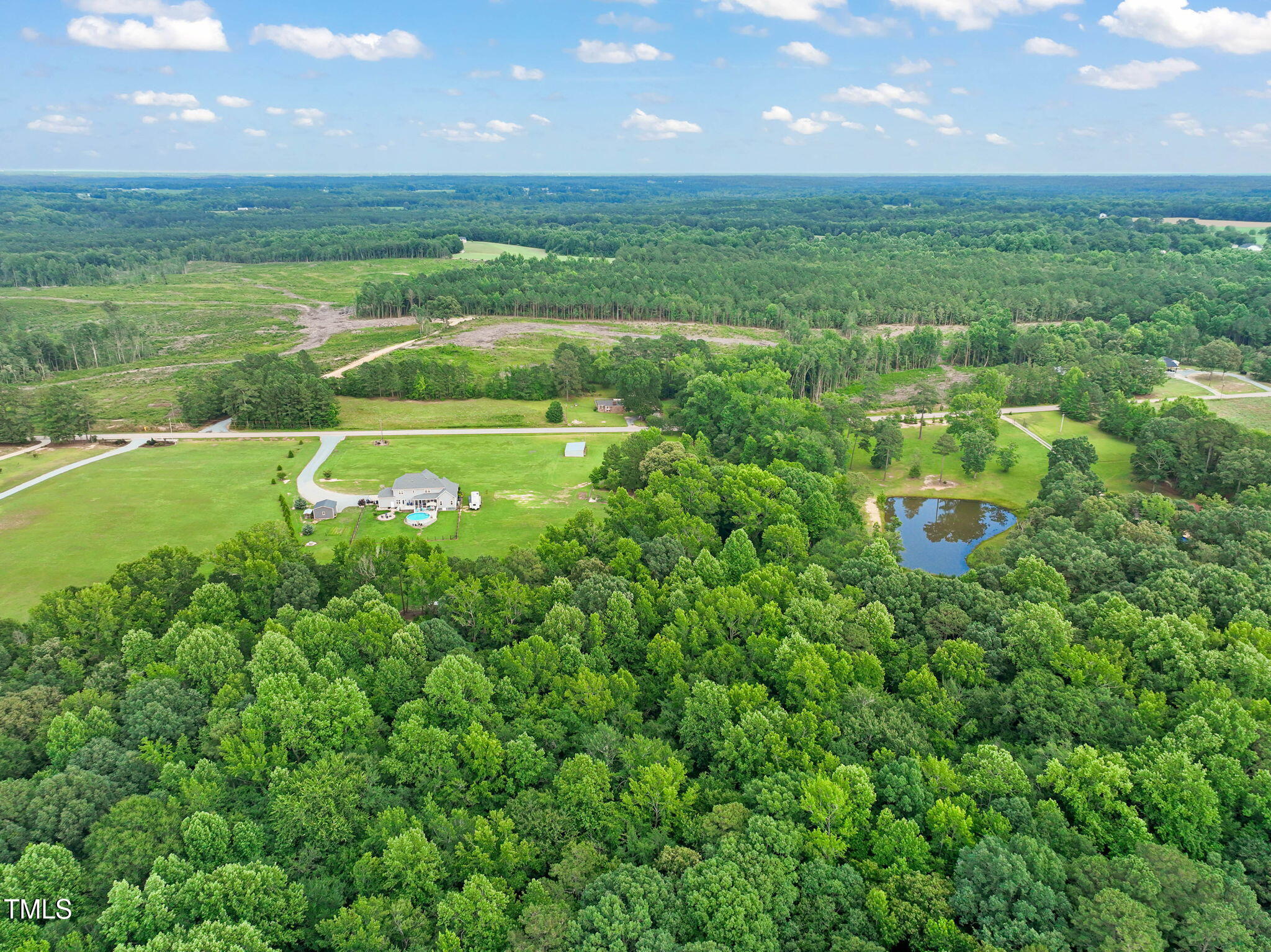 Lot 2 Raleigh Road Four Oaks, NC 27524 - Photo 9 of 12 a view of a green yard with a large trees