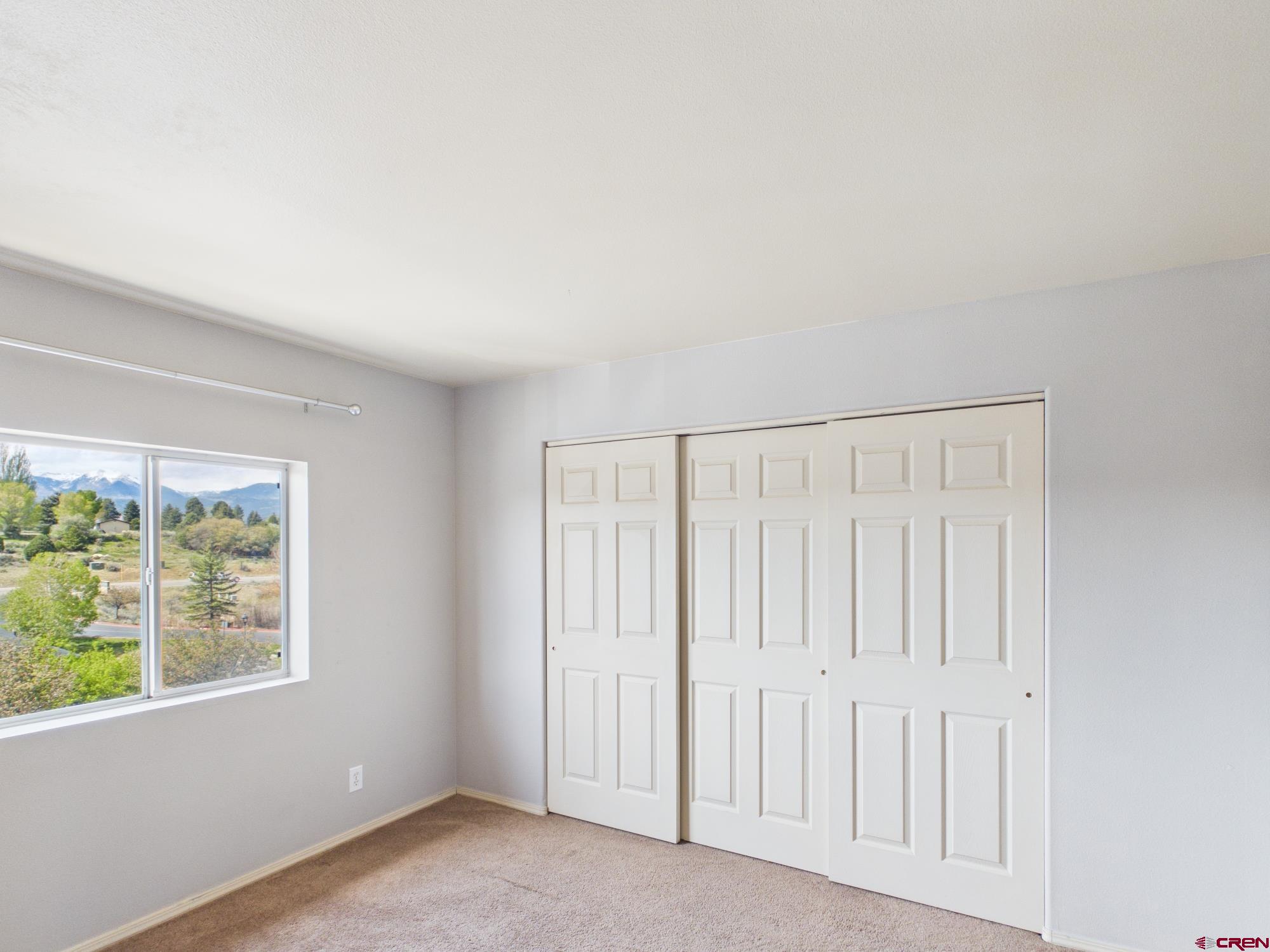 1100 Goeglein Gulch, Unit 216 Durango, CO 81301 - Photo 11 of 25 an empty room with windows