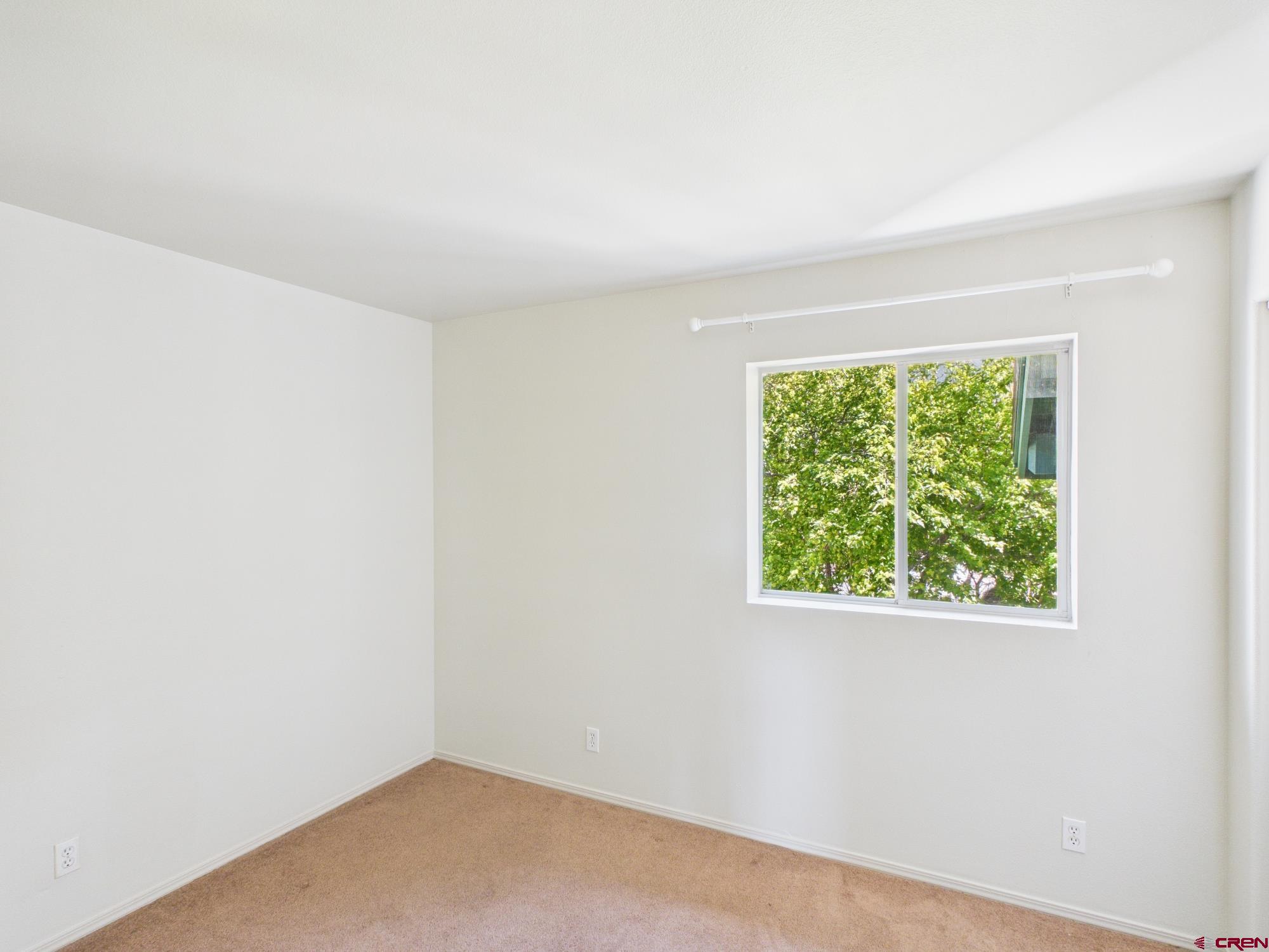 1100 Goeglein Gulch, Unit 216 Durango, CO 81301 - Photo 12 of 25 an empty room with a window