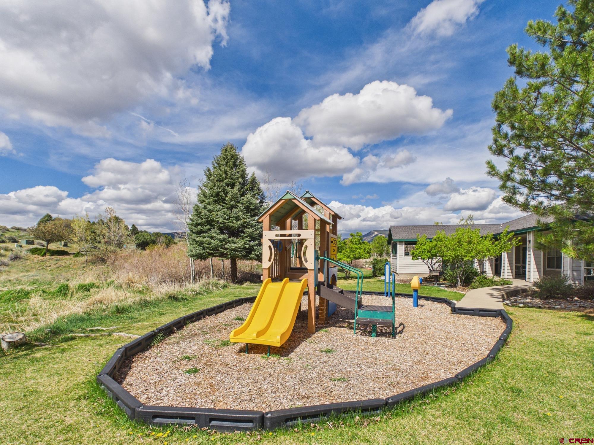 1100 Goeglein Gulch, Unit 216 Durango, CO 81301 - Photo 20 of 25 a view of a fountain in the backyard of the house
