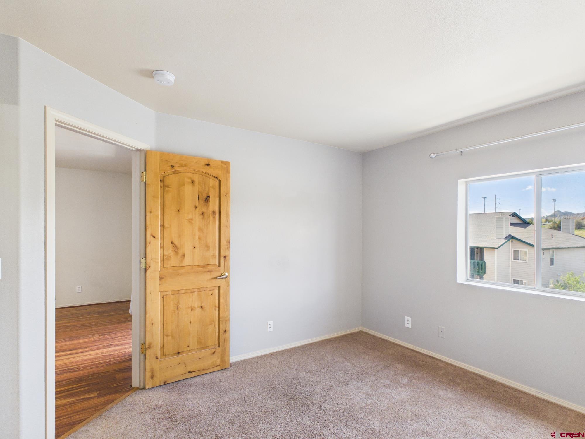 1100 Goeglein Gulch, Unit 216 Durango, CO 81301 - Photo 10 of 25 an empty room with a door