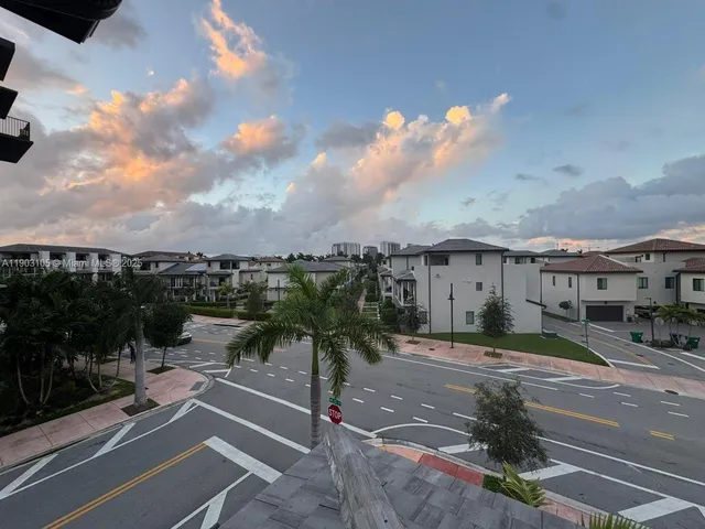 a view of an empty room and a window