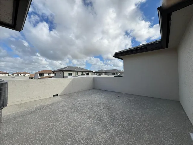 a view of an empty room with a balcony
