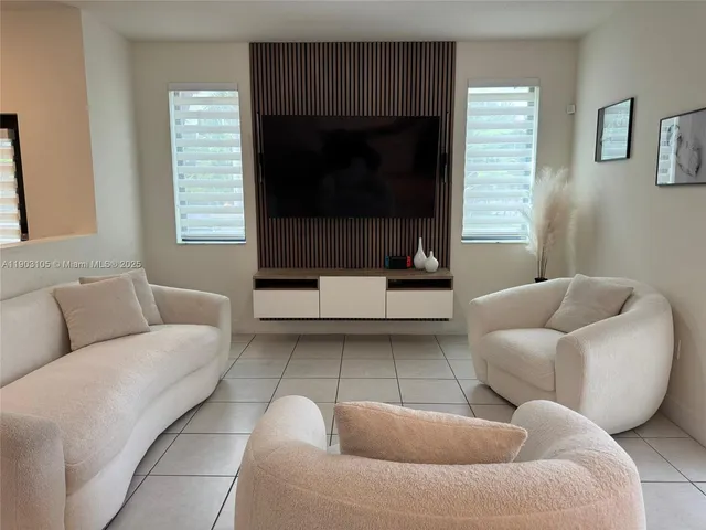 a living room with furniture and a couch