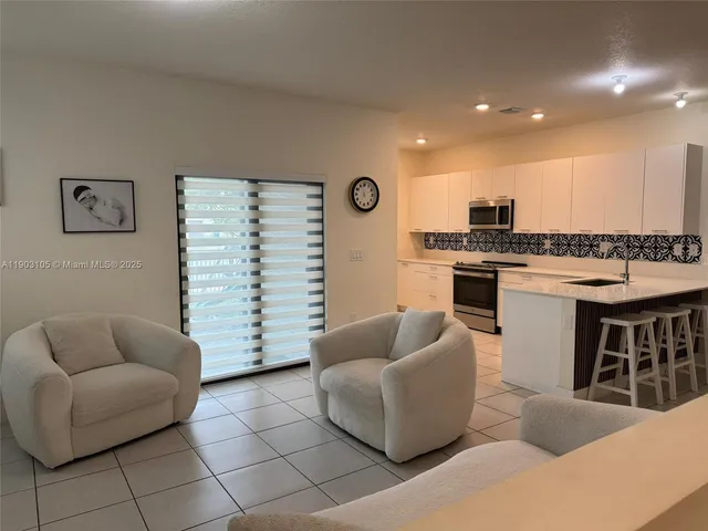 a view of storage and utility room with racks on the wall