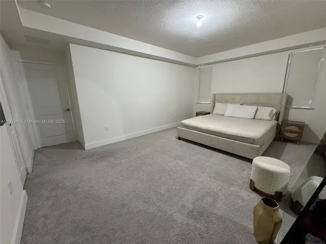 a white toilet sitting next to a shower curtain