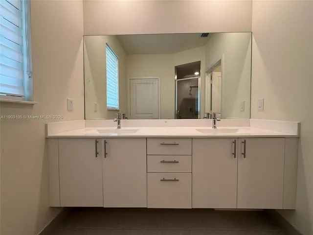 a view of an empty room with stairs and ventilation