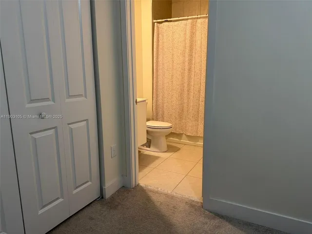 a lobby with furniture and floor to ceiling window