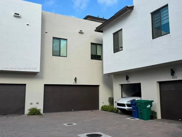 a view of a building with a yard