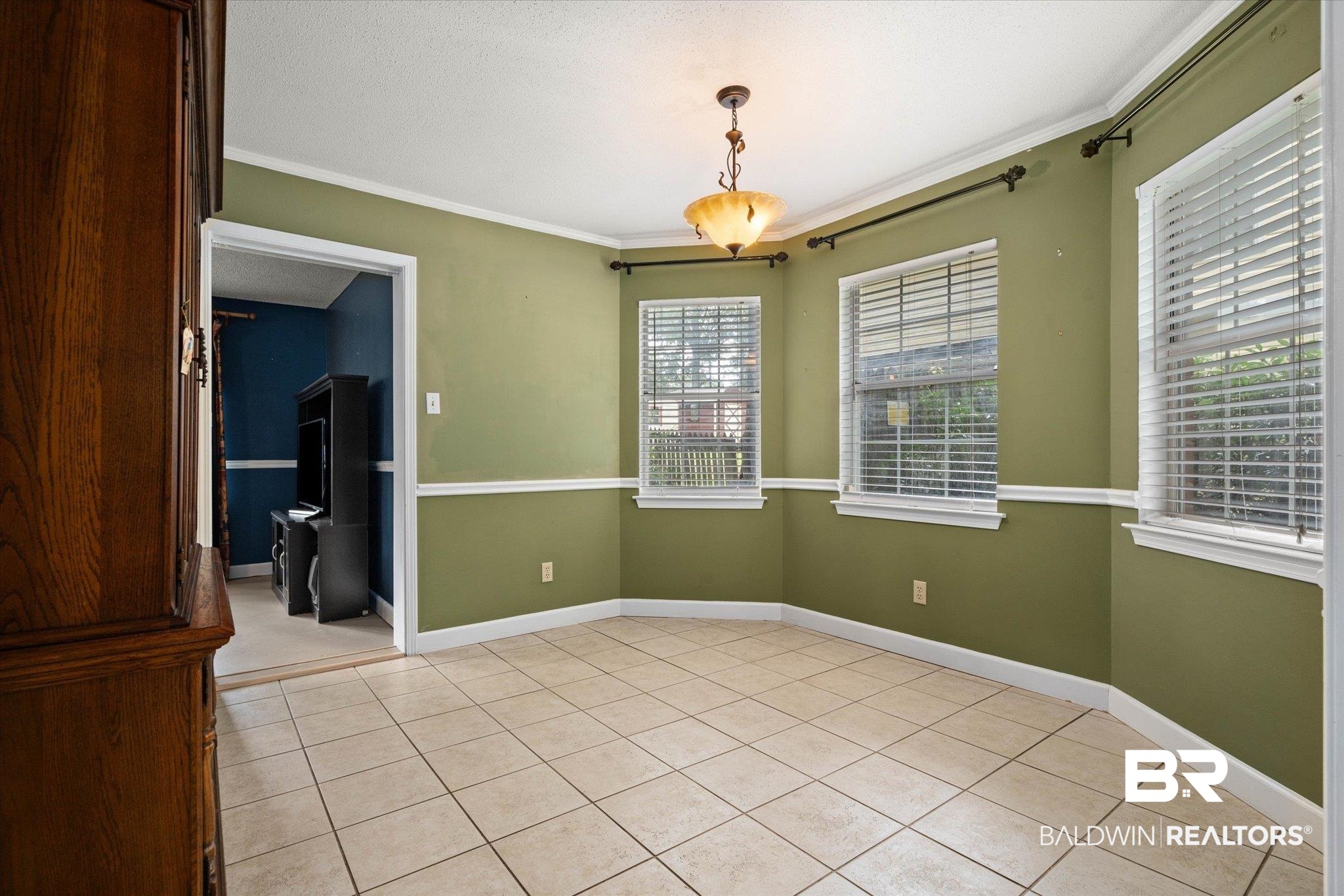 6632 Autumn Ridge Drive Mobile, AL 36695 - Photo 6 of 22 room with crown molding and light tile patterned floors