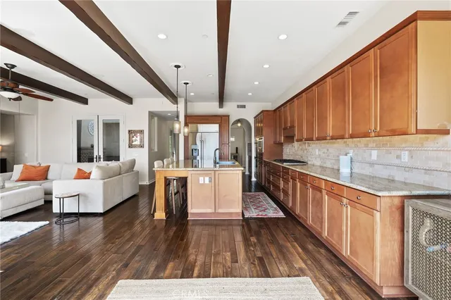 a bedroom with bed and wooden floor
