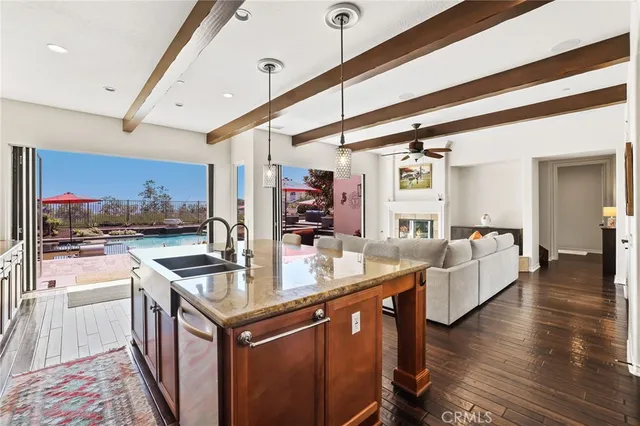 a view of a livingroom with a fireplace and windows