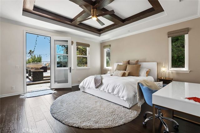 a very nice looking room with a large window and chandelier