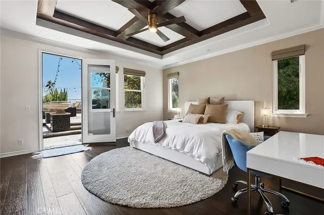 a very nice looking room with a large window and chandelier