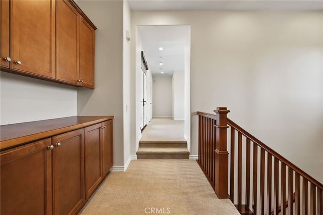 a bathroom with a granite countertop sink mirror and toilet