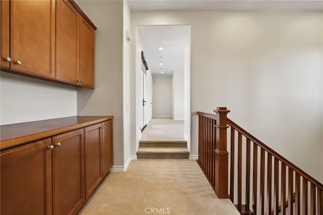 a bathroom with a granite countertop sink mirror and toilet