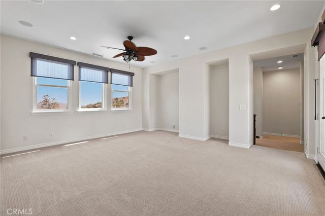a bathroom with a toilet a sink and a mirror