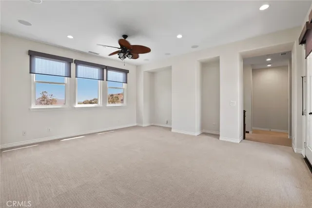 a bathroom with a toilet a sink and a mirror