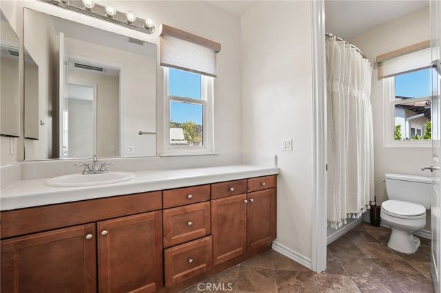 a view of a house with swimming pool and sitting area
