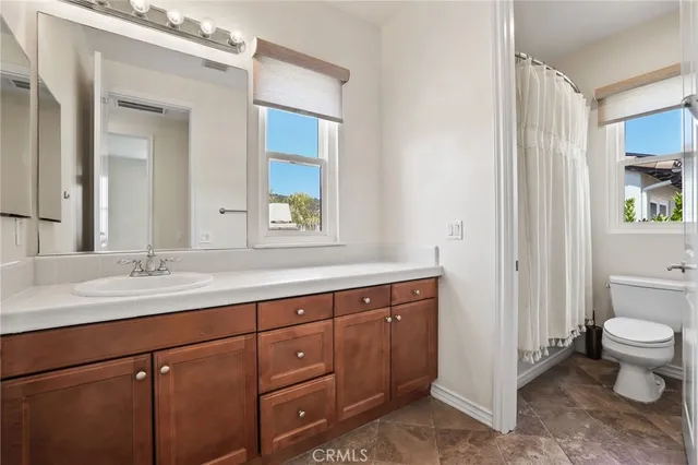 a view of a house with swimming pool and sitting area
