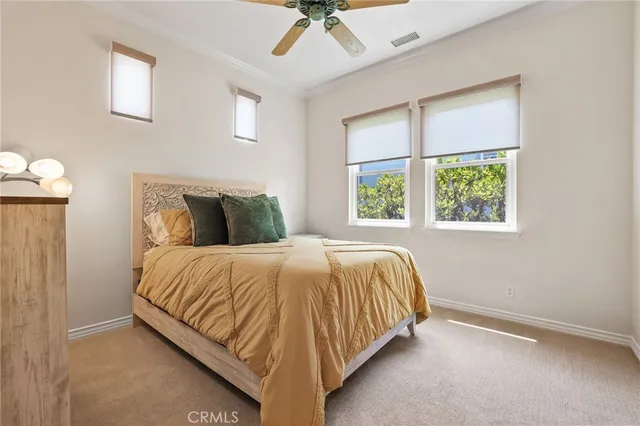a view of a lake with couches chairs and a table of the ocean
