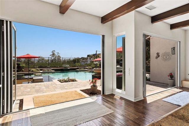 a view of a patio with couches chairs and a fireplace
