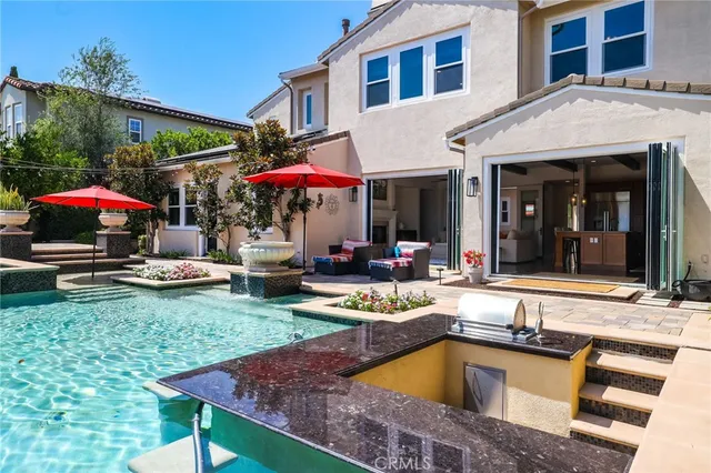 a front view of house with yard and outdoor seating