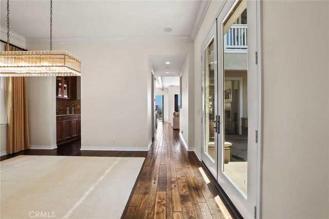 a living room with furniture and a large mirror