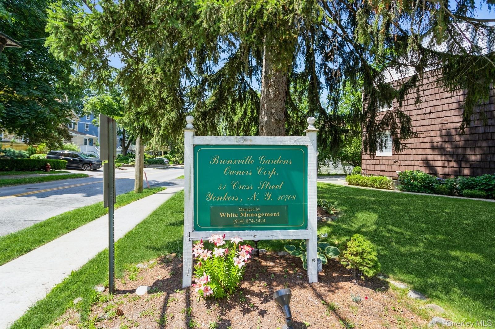 51 Cross Street, Unit 3A Yonkers, NY 10708 - Photo 17 of 17 Community sign with a yard