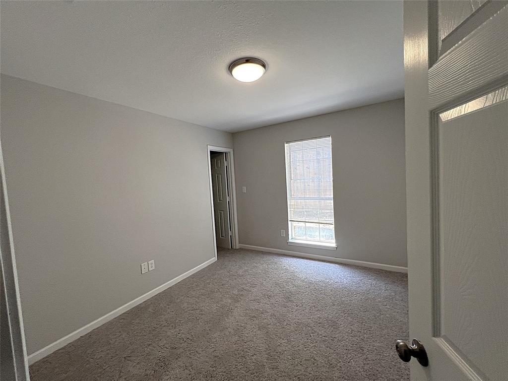 902 Mack Place Denton, TX 76209 - Photo 4 of 11 an empty room with windows