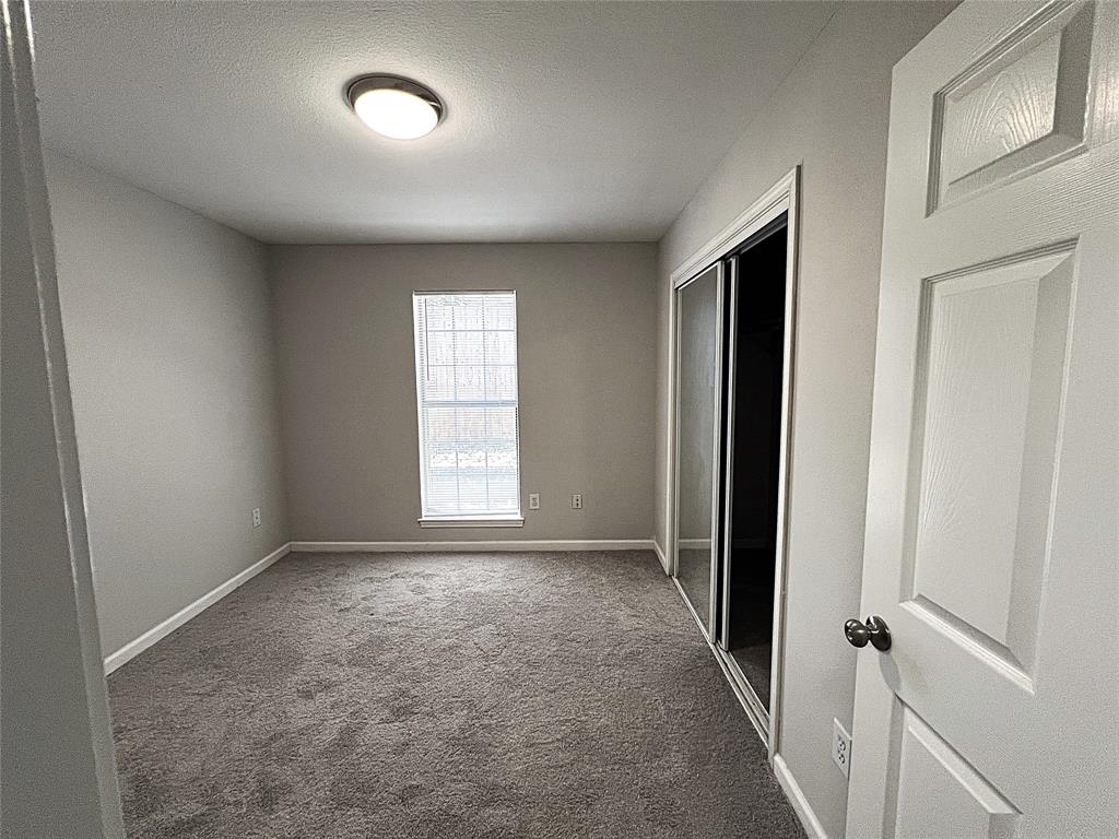 902 Mack Place Denton, TX 76209 - Photo 5 of 11 an empty room with windows