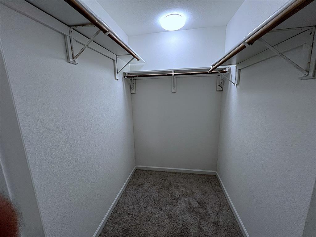 902 Mack Place Denton, TX 76209 - Photo 8 of 11 a view of a room with racks on the wall