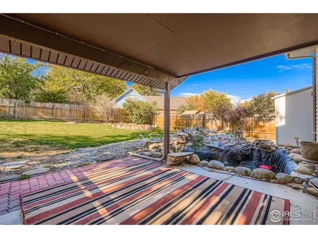 a view of a two chairs in the balcony