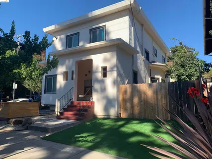 a view of house with yard