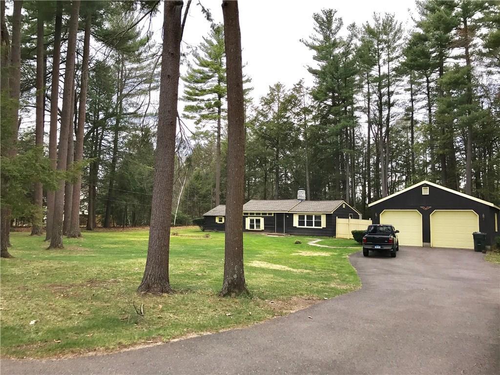 a house view with a play ground in front of it