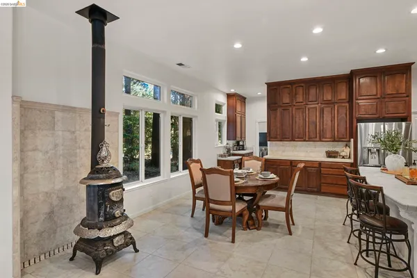 a view of a dining room with furniture window and outside view
