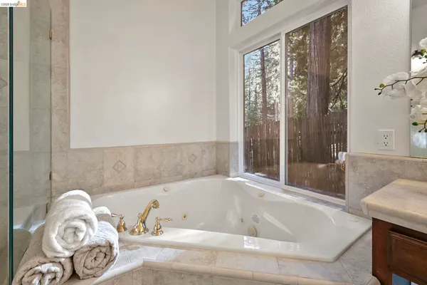 a bathroom with a tub and a shower
