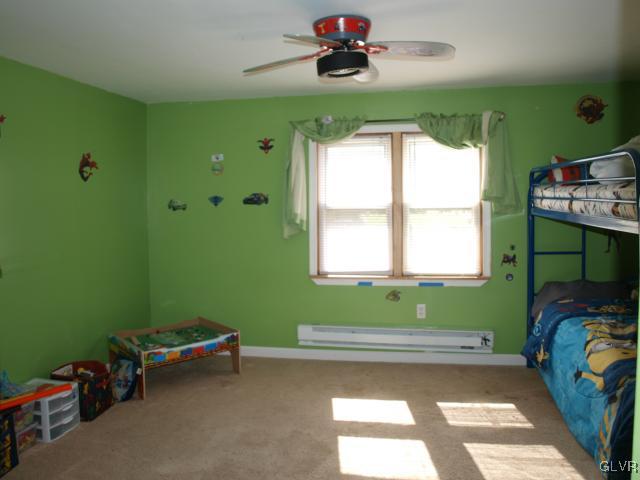 429 Old Grade Road Wind Gap, PA 18091 - Photo 17 of 20 a bedroom with a bed and windows