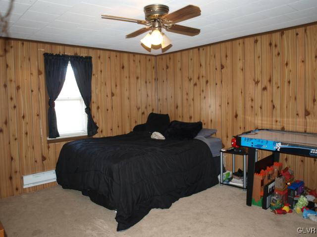 429 Old Grade Road Wind Gap, PA 18091 - Photo 18 of 20 a bed sitting in a room next to a window