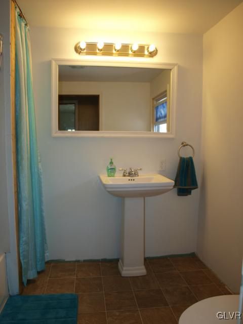 429 Old Grade Road Wind Gap, PA 18091 - Photo 20 of 20 a bathroom with a sink and mirror