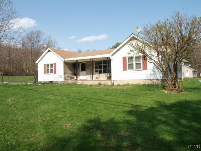 429 Old Grade Road Wind Gap, PA 18091 - Photo 3 of 20 a front view of house with yard and green space