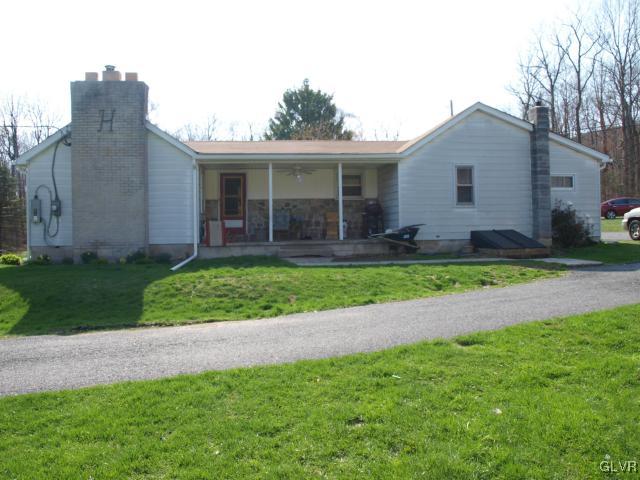 429 Old Grade Road Wind Gap, PA 18091 - Photo 5 of 20 a front view of house with yard and green space