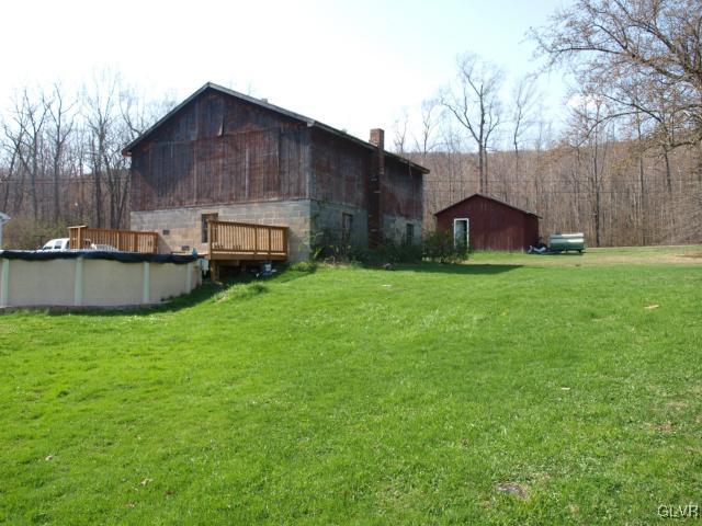 429 Old Grade Road Wind Gap, PA 18091 - Photo 8 of 20 a view of a house with backyard and a garden